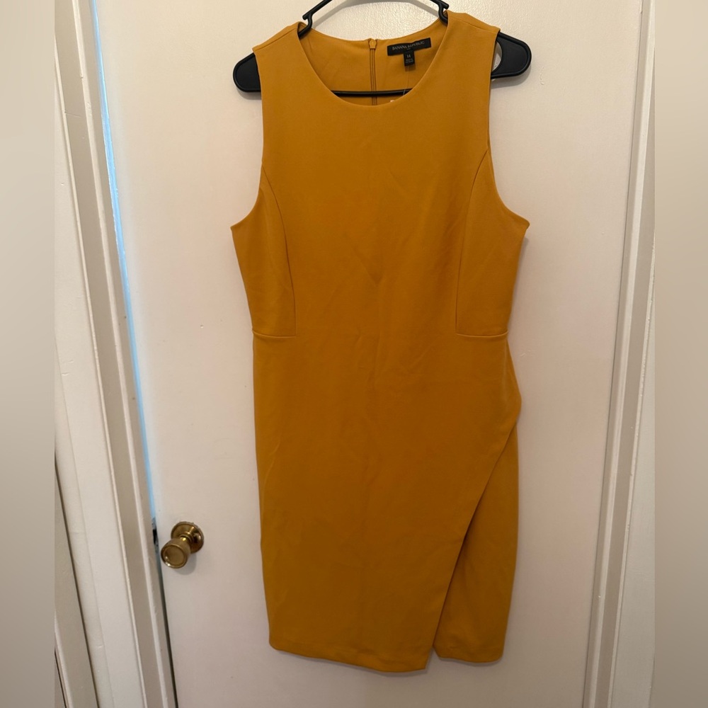 Gold tank (sleeveless dress) with bottom
Slit perfect for boardroom, brunch